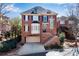 Charming brick home featuring a two-car garage, landscaped front yard, and traditional architectural details at 1029 Fairway Ne Ests, Atlanta, GA 30319