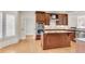 Gourmet kitchen features an island, stainless steel appliances, and custom cabinetry at 1029 Fairway Ne Ests, Atlanta, GA 30319