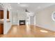 Spacious living room with fireplace, hardwood floors, and a neutral color palette with a ceiling fan at 1029 Fairway Ne Ests, Atlanta, GA 30319