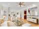 Open-concept living room with modern furniture, a ceiling fan and hardwood floors at 1029 Fairway Ne Ests, Atlanta, GA 30319