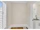 Mudroom features white walls, bright light, wood floors, and an accent sink by the door at 1029 Fairway Ne Ests, Atlanta, GA 30319