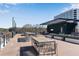 Outdoor terrace with tables, chairs, a modern roof, and string lights at 1029 Fairway Ne Ests, Atlanta, GA 30319