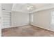 Bright room features a ceiling fan, built in shelves, and plantation shutters on the windows at 2515 Oak Quarters, Smyrna, GA 30080