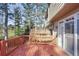 A second-story deck with railing that overlooks backyard trees at 2515 Oak Quarters, Smyrna, GA 30080