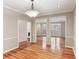 Elegant dining room with hardwood floors, white trim, and modern lighting fixtures at 2515 Oak Quarters, Smyrna, GA 30080
