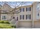 Exterior elevation features a well-maintained facade, garages, and meticulously landscaped front yard at 2515 Oak Quarters, Smyrna, GA 30080