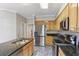 Well-equipped kitchen featuring granite counters, an island sink, and stainless steel appliances at 2515 Oak Quarters, Smyrna, GA 30080