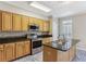 Functional kitchen with stainless steel appliances, island, and blue tile flooring at 2515 Oak Quarters, Smyrna, GA 30080