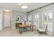 This home office features a light colored rug, plenty of light, and a modern desk at 2515 Oak Quarters, Smyrna, GA 30080