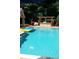 Sparkling in-ground pool featuring patio and pergola with bar seating at 2515 Oak Quarters, Smyrna, GA 30080