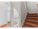 Bright entryway staircase with carpet steps, white walls, and wood railings at 2515 Oak Quarters, Smyrna, GA 30080