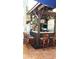 Outdoor tiki bar includes TV, seating, lighting, barware, and signage at 2515 Oak Quarters, Smyrna, GA 30080