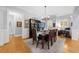 Charming dining room with hardwood flooring, decorative lighting, and beautiful wainscotting throughout at 4620 Westgate Dr, Cumming, GA 30040