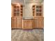 Finished bar area with granite countertops and wooden cabinets that offer display and storage at 1027 Holland Rd, Dallas, GA 30157