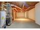 Unfinished basement featuring exposed beams and mechanicals ready to be converted into living space at 1027 Holland Rd, Dallas, GA 30157