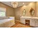 Bathroom featuring a tub, chandelier and double sinks at 1027 Holland Rd, Dallas, GA 30157