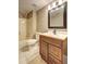 Full bathroom featuring a tub-shower combination, toilet, and wood vanity with an updated mirror at 1027 Holland Rd, Dallas, GA 30157