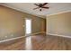 Bright bedroom featuring hardwood floors and a sliding glass door at 1027 Holland Rd, Dallas, GA 30157