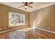Bright bedroom featuring hardwood floors, large windows, and a ceiling fan at 1027 Holland Rd, Dallas, GA 30157