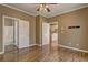 Bedroom boasts hardwood floors and ensuite bathroom adjacent to open kitchen at 1027 Holland Rd, Dallas, GA 30157