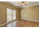 Bedroom featuring hardwood floors, neutral paint and a large window at 1027 Holland Rd, Dallas, GA 30157