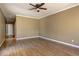 Spacious bedroom featuring hardwood floors and a ceiling fan at 1027 Holland Rd, Dallas, GA 30157