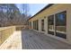 Large wooden deck with railings, offering outdoor living space with scenic backyard views at 1027 Holland Rd, Dallas, GA 30157
