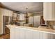 Open kitchen with stainless steel appliances, granite countertops, island, and white cabinetry at 1027 Holland Rd, Dallas, GA 30157