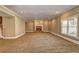 Spacious living room featuring a cozy fireplace and carpeted floors, perfect for relaxation at 1027 Holland Rd, Dallas, GA 30157