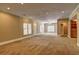 Expansive living area featuring carpet flooring, built-in cabinets, and abundant natural light at 1027 Holland Rd, Dallas, GA 30157