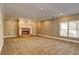 Spacious living room featuring a cozy fireplace and carpeted floors, perfect for relaxation at 1027 Holland Rd, Dallas, GA 30157