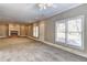 Large living room boasts a fireplace and ample natural light, creating a warm and inviting space at 1027 Holland Rd, Dallas, GA 30157