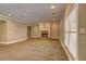Spacious living room featuring a cozy fireplace and carpeted floors, perfect for relaxation at 1027 Holland Rd, Dallas, GA 30157