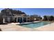 Community pool with a modern clubhouse, providing a perfect spot for relaxation and recreation at 4822 Floydwood Ln, Mableton, GA 30126