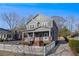 Charming two-story home with inviting front porch and classic white picket fence, enhancing its curb appeal at 65 Vannoy Se St, Atlanta, GA 30317