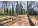 Large, wooded backyard offers plenty of privacy and space for outdoor activities at 1618 Cheryl Leigh Dr, Riverdale, GA 30296