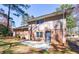 Home's backyard featuring a brick facade, a concrete patio perfect for outdoor entertaining at 1618 Cheryl Leigh Dr, Riverdale, GA 30296