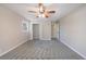 Bedroom with new carpet, overhead fan and lighting, and open closet space at 1618 Cheryl Leigh Dr, Riverdale, GA 30296