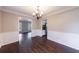 Dining room with hardwood flooring, classic wainscoting and neutral decor at 1618 Cheryl Leigh Dr, Riverdale, GA 30296