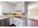 Eat-in kitchen featuring stone countertops, mosaic tile backsplash, and stainless steel dishwasher at 1618 Cheryl Leigh Dr, Riverdale, GA 30296