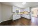 Corner view of eat-in kitchen with stone countertops and stainless steel dishwasher at 1618 Cheryl Leigh Dr, Riverdale, GA 30296