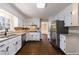 Spacious eat-in kitchen with stainless steel appliances and white cabinets at 1618 Cheryl Leigh Dr, Riverdale, GA 30296