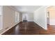 Open living room with hardwood floors and light gray walls at 1618 Cheryl Leigh Dr, Riverdale, GA 30296