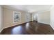 Bright living room featuring hardwood floors, neutral walls, and classic trim at 1618 Cheryl Leigh Dr, Riverdale, GA 30296