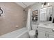 Clean bathroom featuring a shower over tub, vanity with storage, and modern fixtures at 1995 Tara Nw Ct, Kennesaw, GA 30144