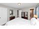 Neutral bedroom with a mirror, recessed lighting, and a view into the bathroom at 1995 Tara Nw Ct, Kennesaw, GA 30144