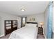 Bright bedroom featuring neutral walls, built-in shelving, and natural light at 1995 Tara Nw Ct, Kennesaw, GA 30144