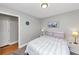 Neutral bedroom features a queen bed, carpet and a large window for natural light at 1995 Tara Nw Ct, Kennesaw, GA 30144