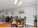 Dining area with modern light fixture and walk-out to deck, perfect for entertaining at 1995 Tara Nw Ct, Kennesaw, GA 30144