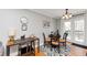 Dining area with modern light fixture and walk-out to deck, perfect for entertaining at 1995 Tara Nw Ct, Kennesaw, GA 30144